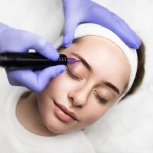 beautician-hand-doing-eyebrow-permanent-makeup-on-2023-08-16-10-11-56-utc-min